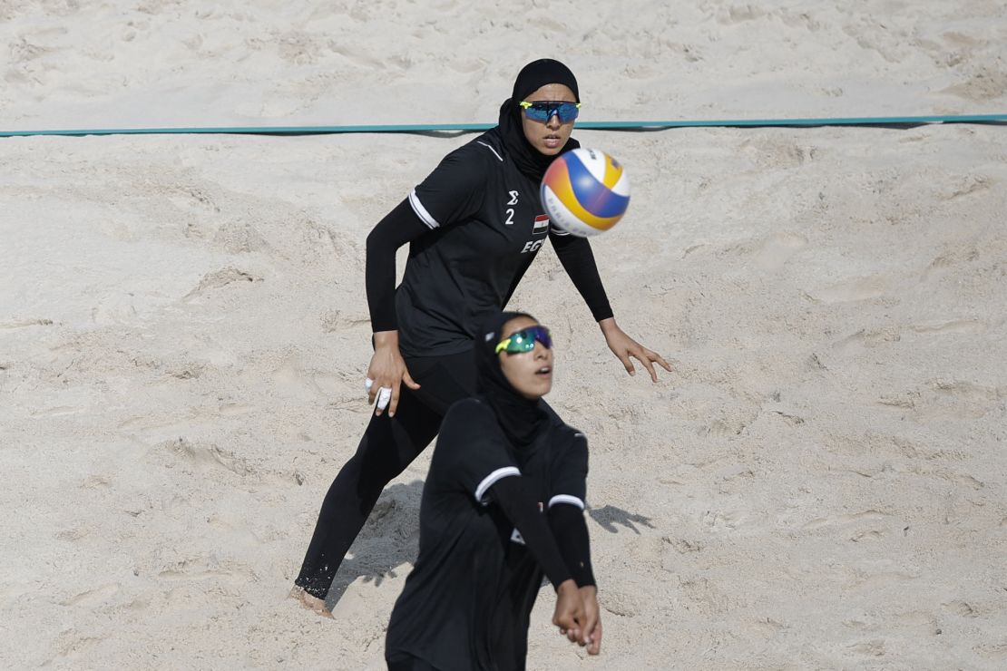 Marwa Abdelhady and Doaa Elghobashy played beach volleyball wearing hijabs, long sleeved shirts, and long pants.