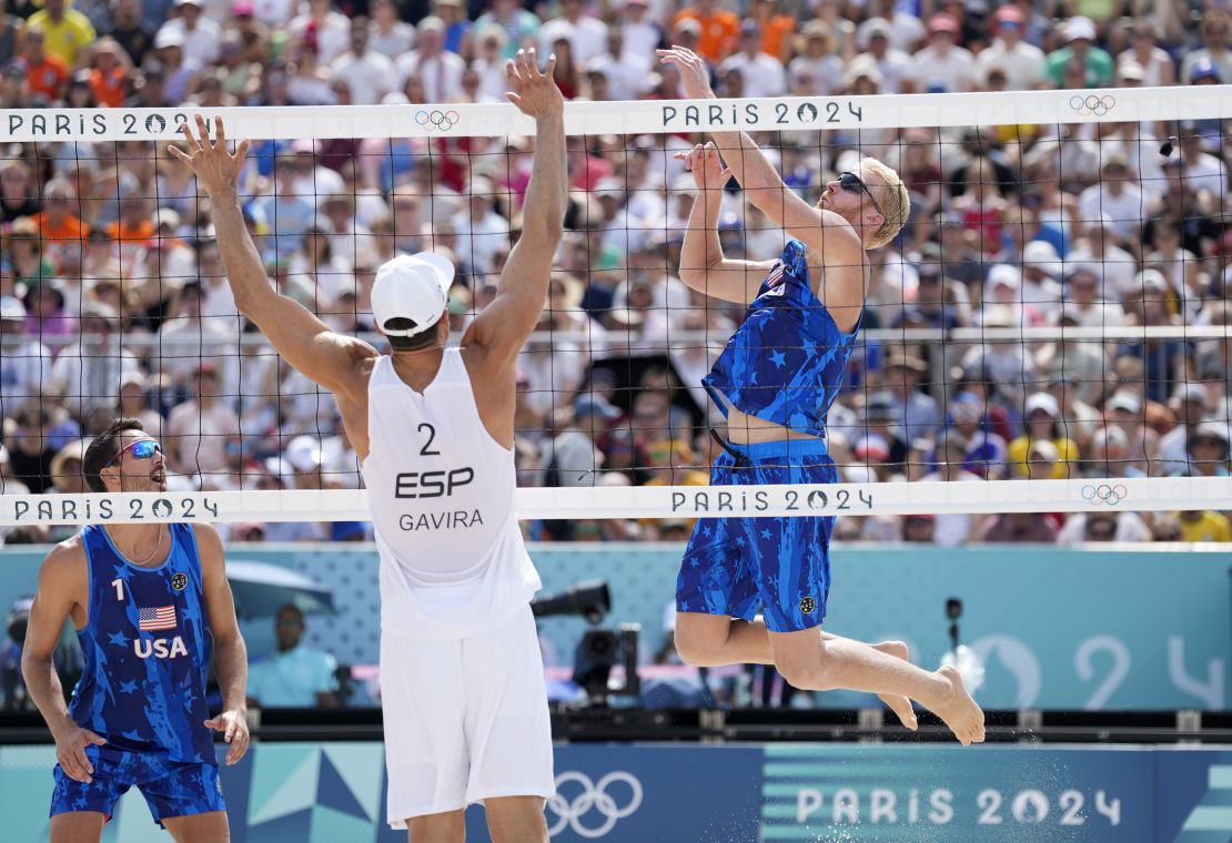 Aug 2, 2024; Paris, France; Chase Budinger (USA) spikes against Adrian Gavira Collado (ESP) during the Paris 2024 Olympic Summer Games at Eiffel Tower Stadium. Mandatory Credit: Kyle Terada-USA TODAY Sports