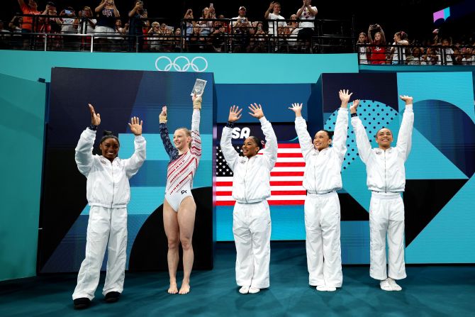 Team USA waves to the crowd as it is introduced at the start of the competition.