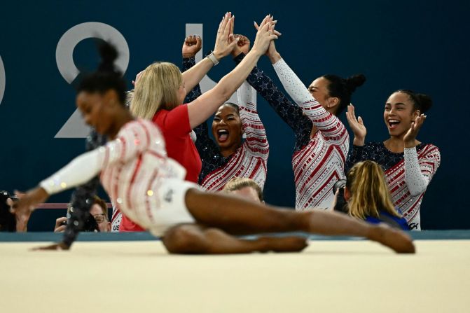 Team USA celebrates as Biles finishes her floor exercise in the Olympic team competition.