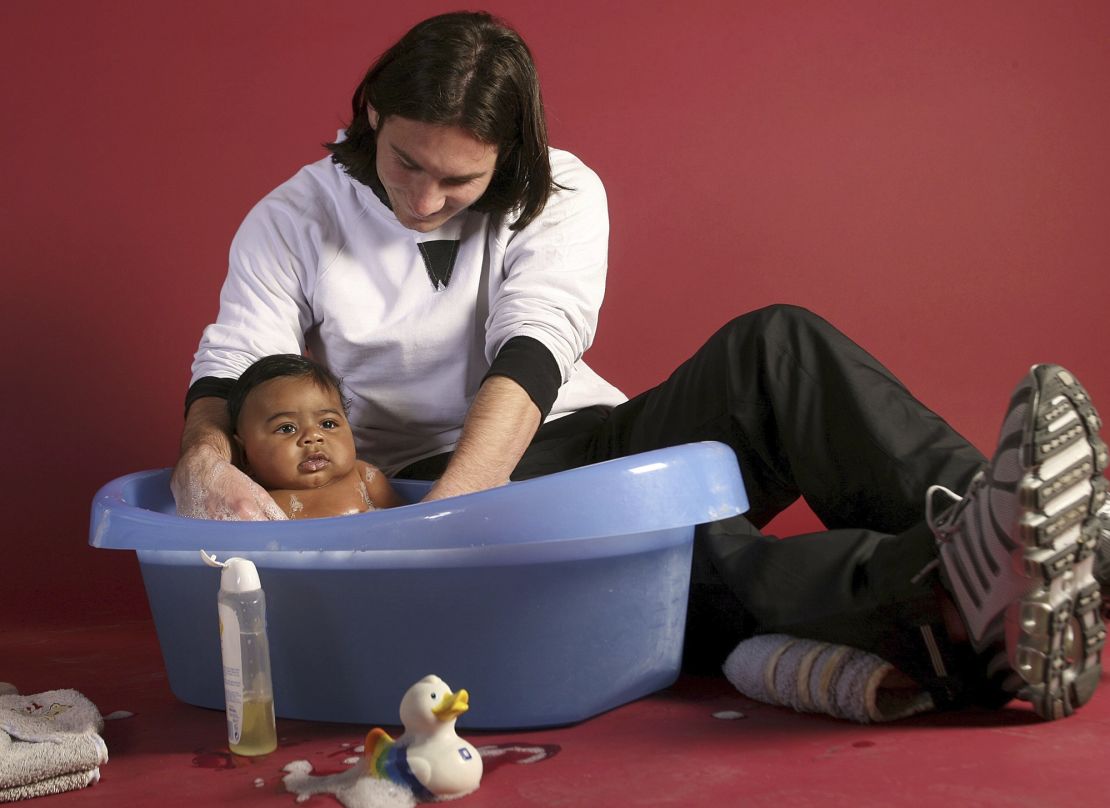 Messi bathes a baby Yamal.