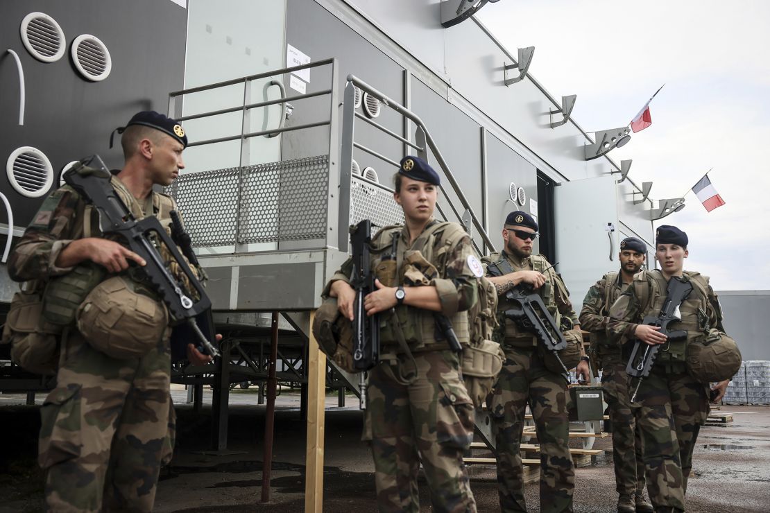 Soldiers leave for a patrol at the military camp set up on the outskirts of Paris.