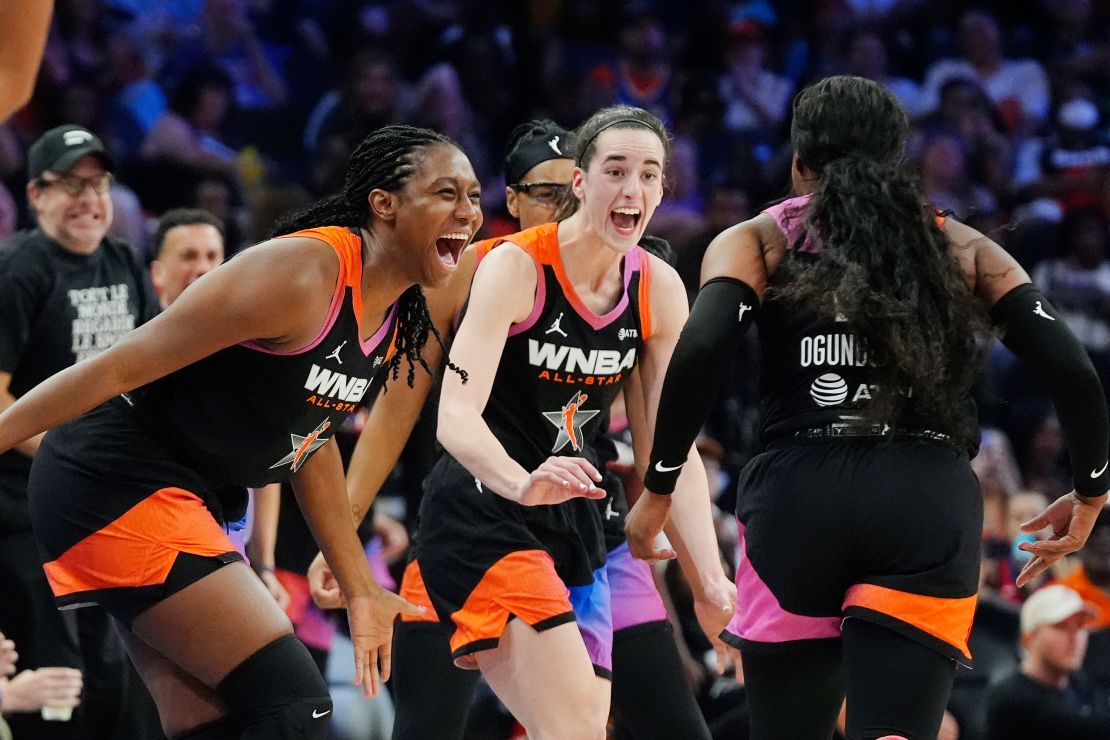 Arike Ogunbowale, right, celebrates after her 3-point basket against Team USA with teammates Caitlin Clark, center, and Aliyah Boston, left.