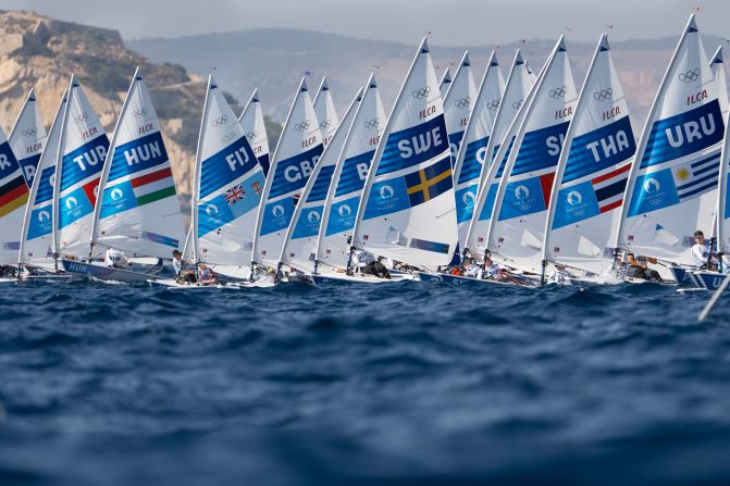 Dinghys take off at the start of a sailing race on August 1.