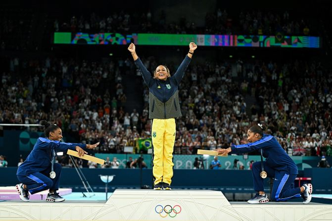 American gymnasts Simone Biles, left, and Jordan Chiles <a href="https://www.cnn.com/sport/live-news/paris-olympics-news-2024-08-05#h_50b58405671680084384da391d48ef6f">bow to Brazil's Rebeca Andrade</a> after she won Olympic gold in the floor exercise on August 5. It was <a href="https://www.cnn.com/2024/08/06/sport/us-gymnasts-sportsmanship-wins-hearts-podium-int-hnk/index.html">the first all-Black Olympics gymnastics podium</a>. However, on August 11, the International Olympic Committee announced that <a href="https://www.cnn.com/sport/live-news/paris-olympics-news-closing-ceremony#h_55351da504525ebe71af920a8ed27e95">Chiles' bronze medal would be reallocated to Romanian gymnast Ana Bărbosu</a> after the Court of Arbitration for Sport ruled that an appeal made by the United States over Chiles' score was filed too late.