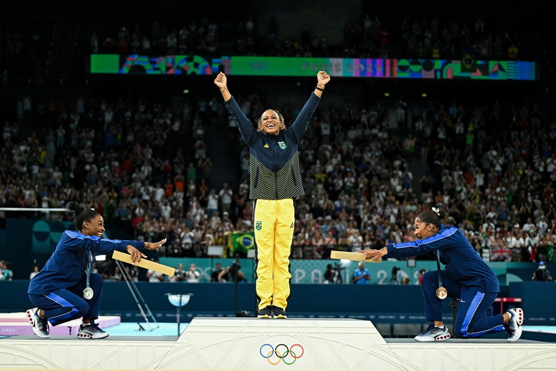 Left to right, US' Simone Biles (silver), Brazil's Rebeca Andrade (gold) and US' Jordan Chiles (bronze) pose during the podium ceremony for the artistic gymnastics women's floor exercise event of the Paris 2024 Olympic Games at the Bercy Arena in Paris, on August 5.