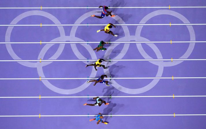 Athletes compete in an incredibly close men's 100-meter final on August 4. Lyles, third from bottom, beat Jamaica’s <a href="https://www.cnn.com/sport/live-news/paris-olympics-news-2024-08-04#h_1de916312fdeaa8d68dd734d8c6c6eca">Kishane Thompson</a> by five-thousandths of a second.