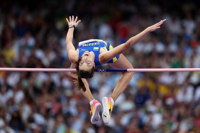 Yaroslava Mahuchikh of Ukraine clears the bar during the <a href="https://www.cnn.com/sport/live-news/paris-olympics-news-2024-08-04#h_d6b63cb426b636b9891378f9d06fefdc">women's high jump final</a> August 4. Mahuchikh won the event on a tiebreaker for having the fewest failed jumps throughout the competition. “Finally, I got this gold medal,” the defending world champion said, reflecting on her bronze medal from Tokyo. “I’m looking forward to the next competition.”