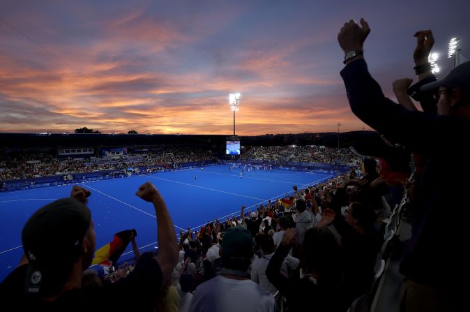 Spectators celebrate Germany's victory over Argentina in a quarter-final field hockey match on August 4.