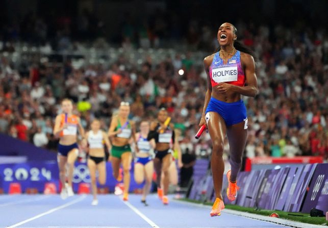 Alexis Holmes crosses the finish line to win gold for the United States in the <a href="https://www.cnn.com/sport/live-news/paris-olympics-news-2024-08-10#h_97964e08f95ff74e0bc68039d9a0f1a5">4x400 relay </a>on August 10. The United States finished a staggering 50 meters clear of the second-place team.