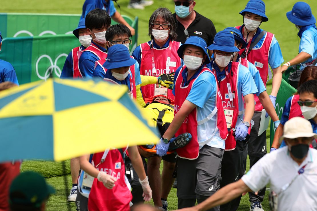 Sakakibara is carried away after a crash during the semifinal of BMX racing at the Tokyo Games.