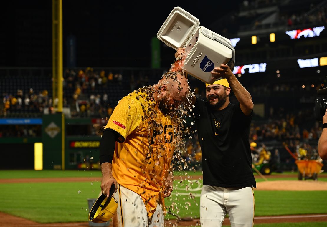 Rowdy Tellez gets water and seeds dumped on him by Martín Pérez during a postgame interview.