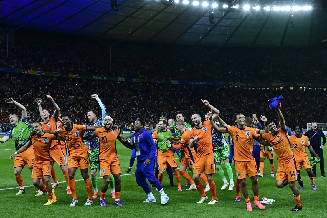 Dutch players dance to 'Links Rechts' on the pitch after beating Turkey in the quarterfinals.