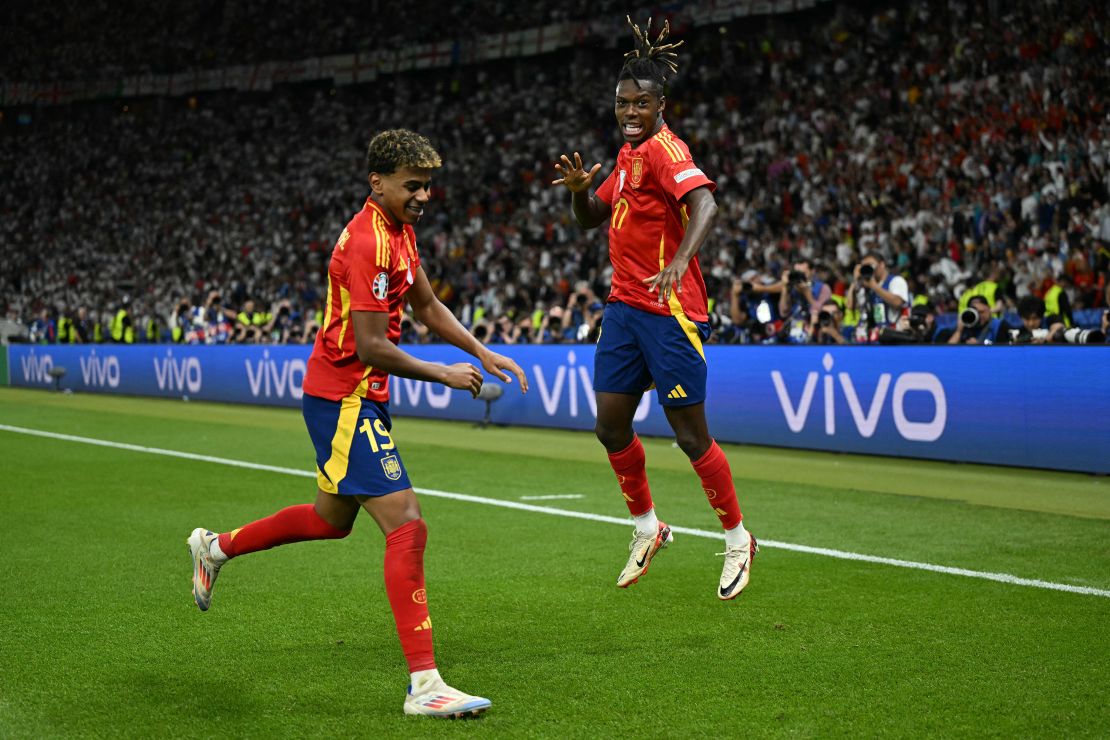 Nico Williams (right) celebrates with his teammate Lamine Yamal after scoring Spain's first goal against England in the Euro 2024 final.