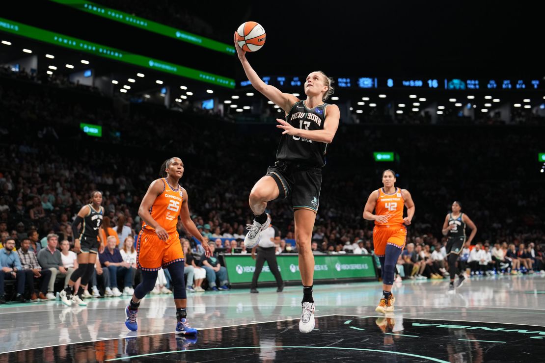 Leonie Fiebich drives to the basket against the Connecticut Sun.