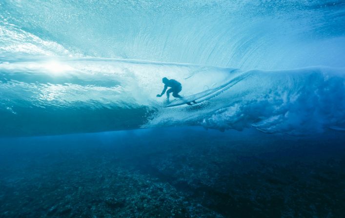 France's Joan Duru gets into the barrel during the first round of the surfing competition on July 27. The surfing events are <a href="https://www.cnn.com/2024/07/08/sport/tahiti-summer-olympics-2024/index.html">taking place in Tahiti</a>, far away from Paris.