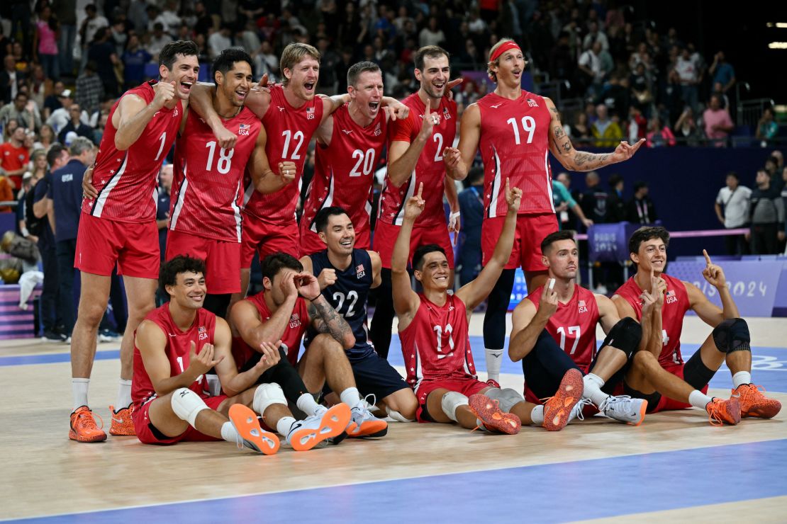 Smith (back row, third from right) celebrates with his US teammates after they beat Argentina in the team's opening game at the 2024 Olympics.