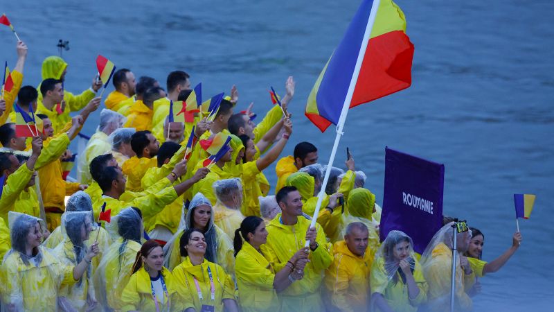 Olympic moment of the day: Married couple makes history as Romania’s flag bearers