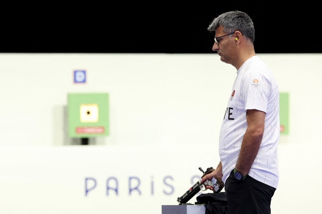 Turkey's Yusuf Dikec competes in the shooting 10m air pistol mixed team gold medal match during the Paris 2024 Olympic Games at Chateauroux Shooting Centre on July 30, 2024.