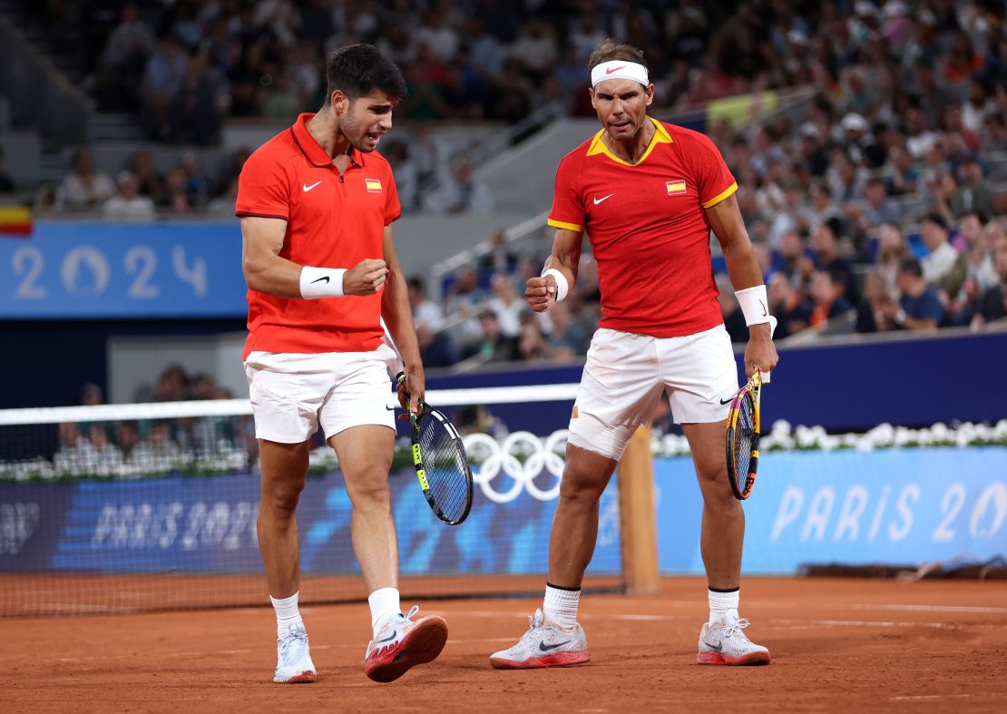 PARIS, FRANCE - JULY 27: Rafael Nadal (R) and partner Carlos Alcaraz of Team Spain celebrate against Andres Molteni and Maximo Gonzalez of Team Argentina during the Men's Doubles first round match on day one of the Olympic Games Paris 2024 at Roland Garros on July 27, 2024 in Paris, France. (Photo by Clive Brunskill/Getty Images)