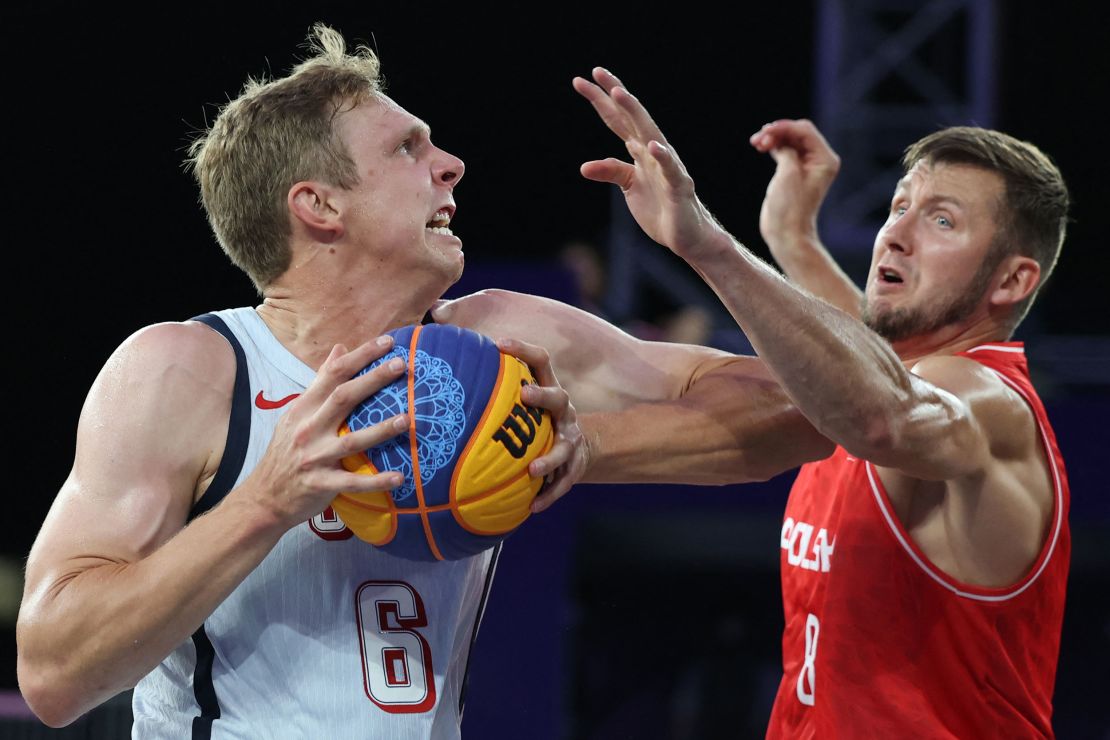 Poland's Przemyslaw Zamojski tries to block Barry during a game on Thursday.