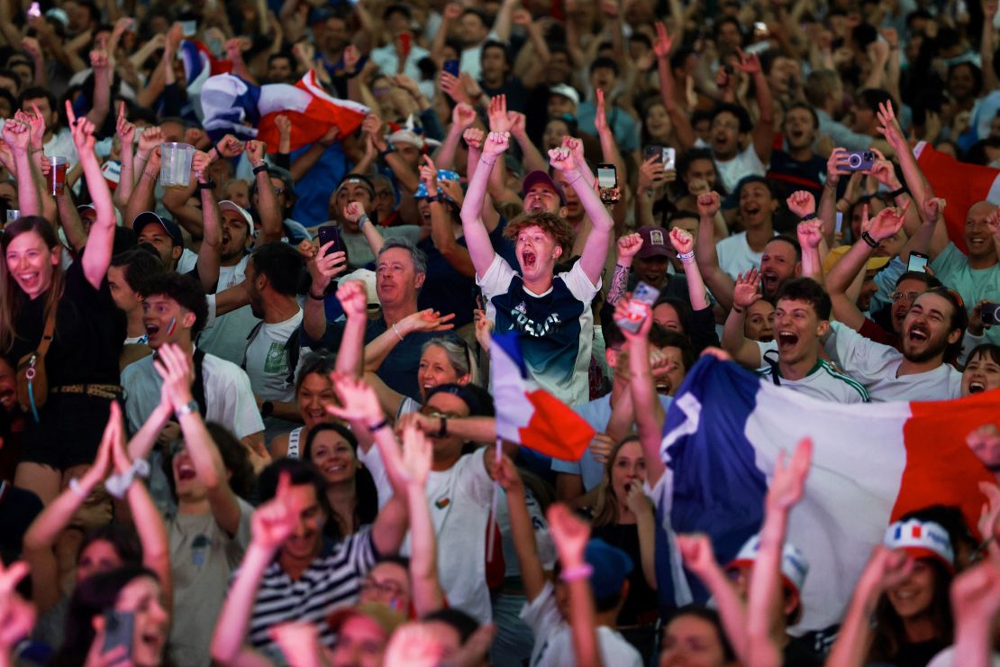 French fans watching men's BMX racing celebrate afterwards.