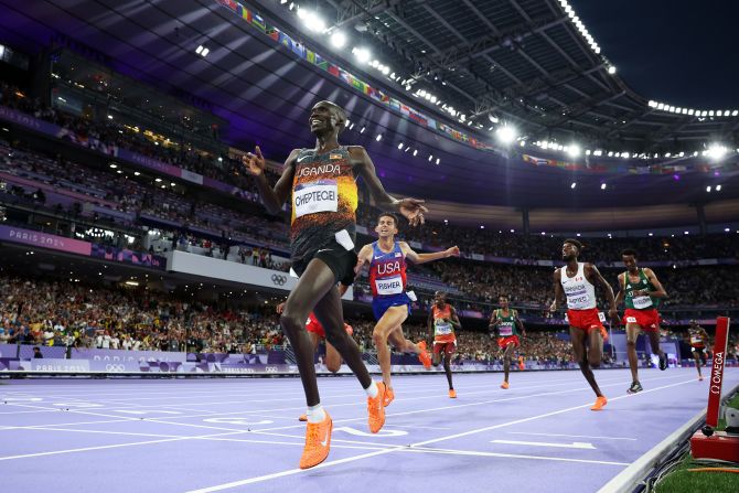 Joshua Cheptegei of Uganda celebrates winning the men's 10,000-meter on August 2. Cheptegei set an Olympic record on his way to the gold medal.