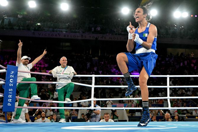 Algerian boxer Imane Khelif celebrates after <a href="https://www.cnn.com/sport/live-news/paris-olympics-news-2024-08-06#h_2b5d522560b4ed2b12bf0157c1dd6546">she defeated Thailand’s Janjaem Suwannapheng</a> in a welterweight semifinal on August 6. <a href="https://www.cnn.com/2024/08/02/sport/who-is-imane-khelif-olympic-boxer-intl/index.html">Khelif has been subject to a torrent of abuse</a> during these Games, with prominent anti-trans figures, right-wing commentators and politicians incorrectly calling Khelif a man.