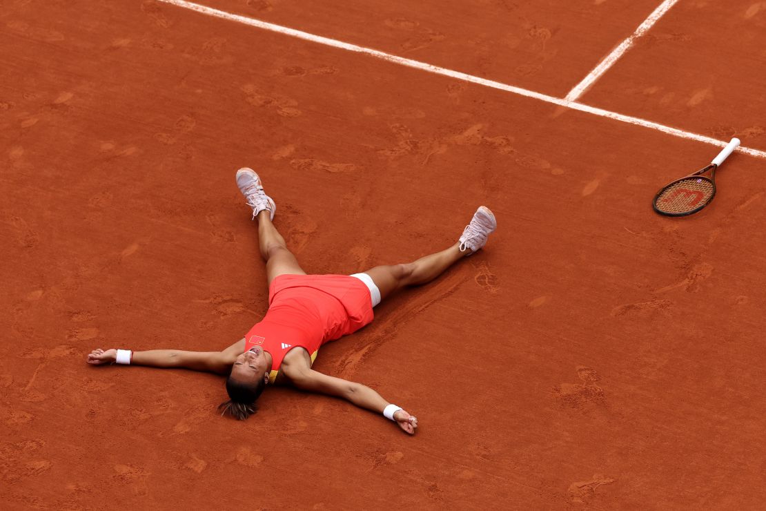 Zheng reacts to winning match point against Vekić.