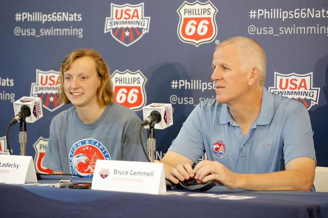 Katie Ledecky and Bruce Gemmell speak during the 2014 Phillips 66 USA National Championships on August 5, 2014 in Irvine, California.