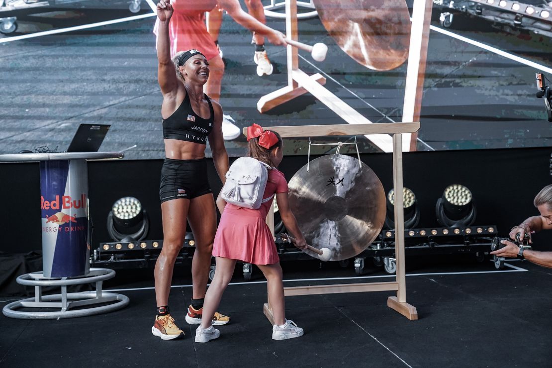 Jacoby crosses the finish line in Nice and is greeted by her nine-year-old daughter.