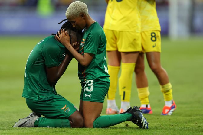 Zambia's Martha Tembo consoles teammate Barbra Banda after Australia <a href="https://www.cnn.com/sport/live-news/paris-olympics-news-2024-07-28#h_7e5e7a0aa09e904a647abd3da1c31ac9">came back from a 5-2 deficit to win 6-5</a> in their soccer match on July 28.