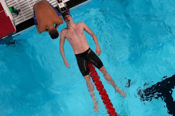 Germany's Lukas Maertens falls back on a lane rope after <a href="https://www.cnn.com/sport/live-news/paris-olympics-news-2024-07-27#h_1beab8746685bb7d0ce495bbcc6c3618">winning the 400-meter freestyle</a> on July 27.