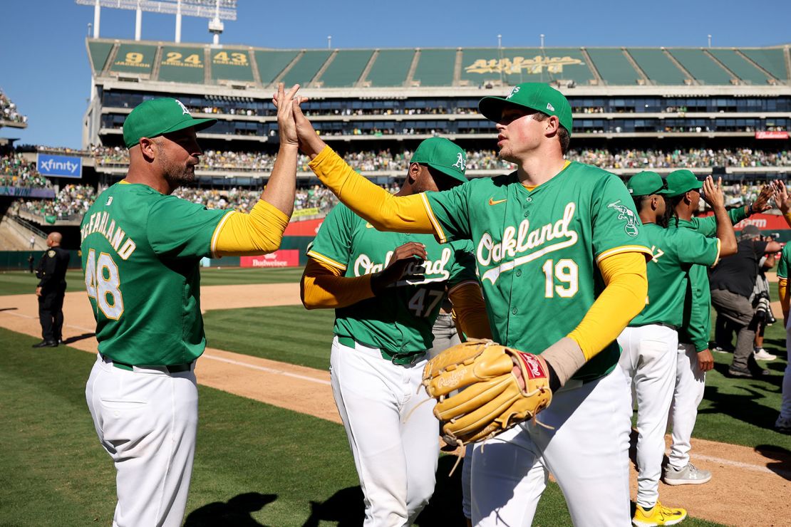 Athletics reliever Mason Miller (No. 19) and teammates celebrate the final home win in Oakland.