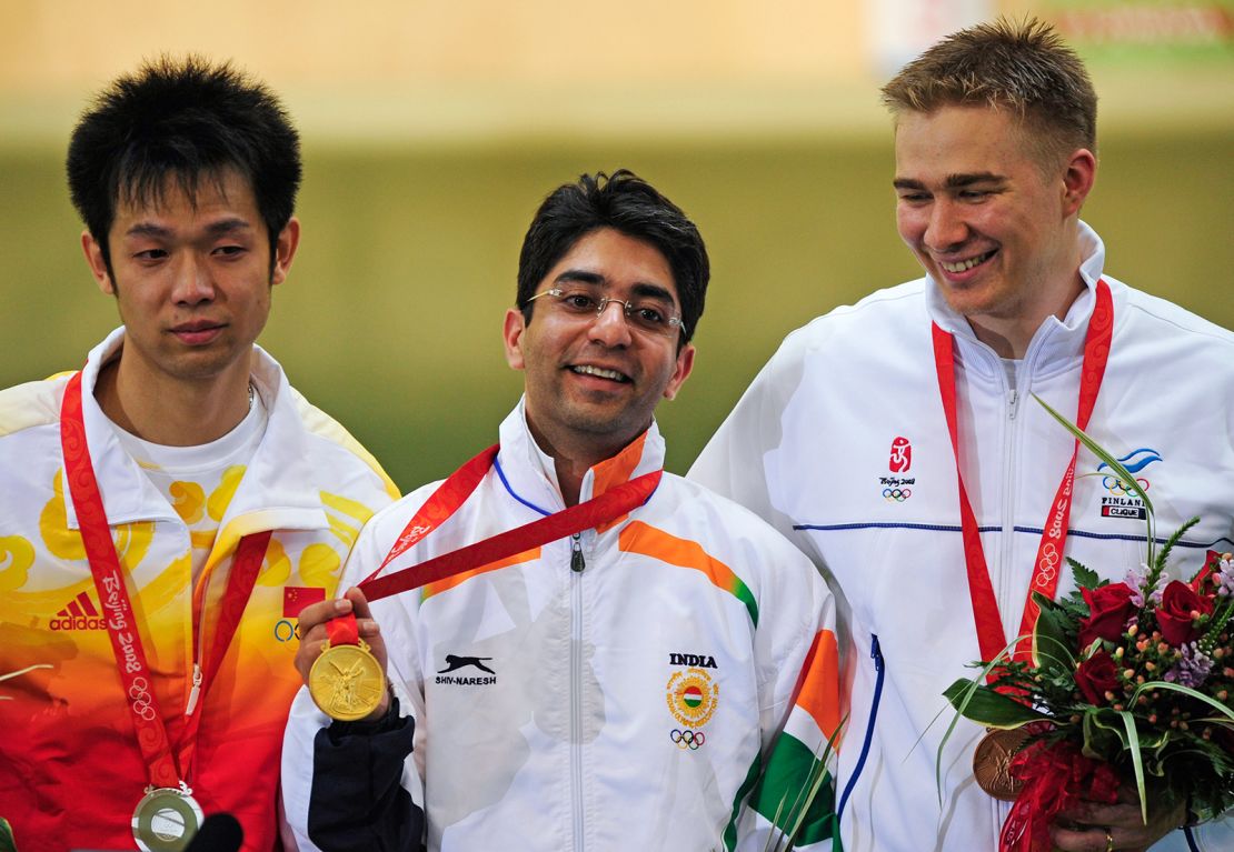 Abhinav Bindra shows off India’s first-ever individual Olympic gold in the men's 10m air rifle shooting competition at the Beijing 2008 Olympic Games on August 11, 2008.