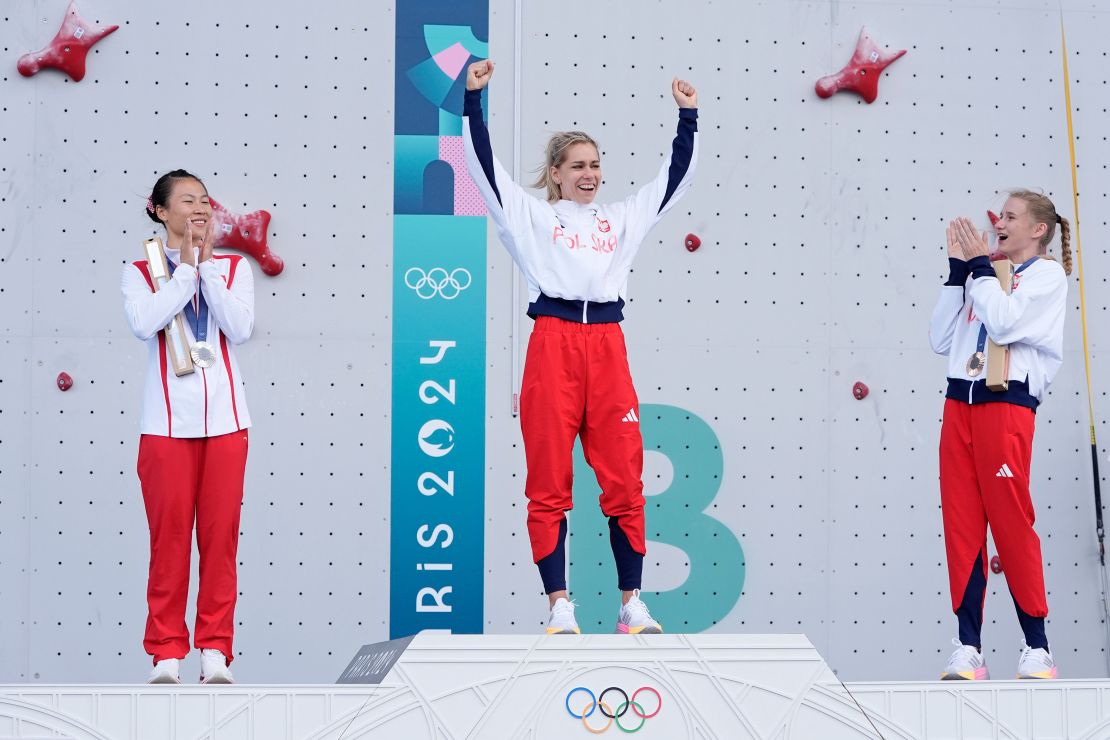 Mirosław stands atop the speed climbing podium.