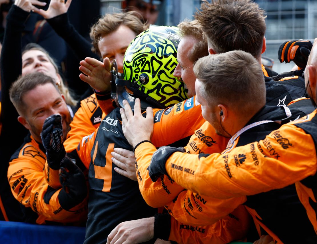 Norris celebrates with his team after winning the Dutch Grand Prix.