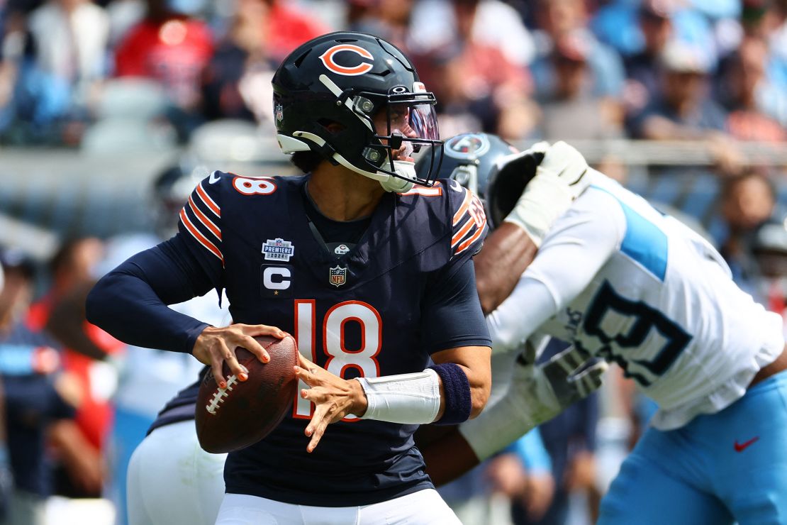 Sep 8, 2024; Chicago, Illinois, USA; Chicago Bears quarterback Caleb Williams (18) drops back to pass during the second half against the Tennessee Titans at Soldier Field. Mandatory Credit: Mike Dinovo-Imagn Images