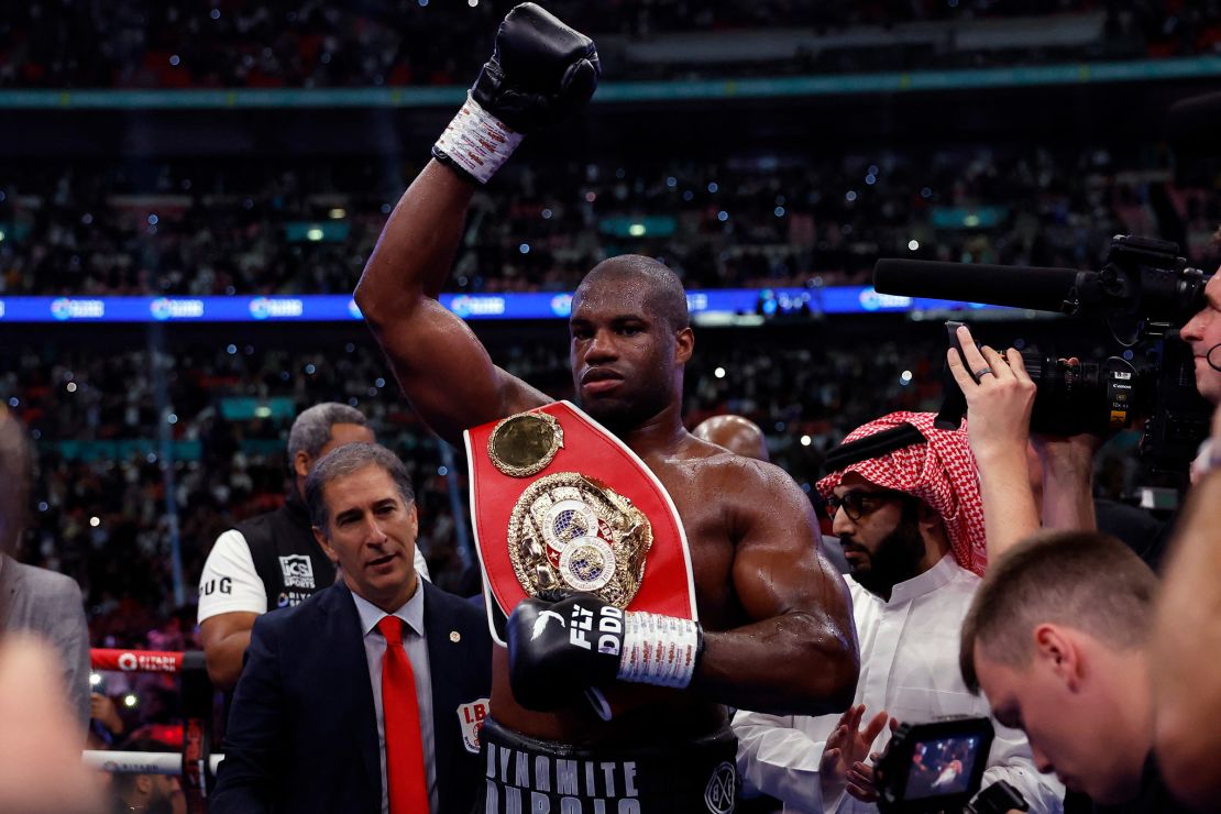 Dubois celebrates after winning his fight against Joshua to retain his IBF heavyweight title.