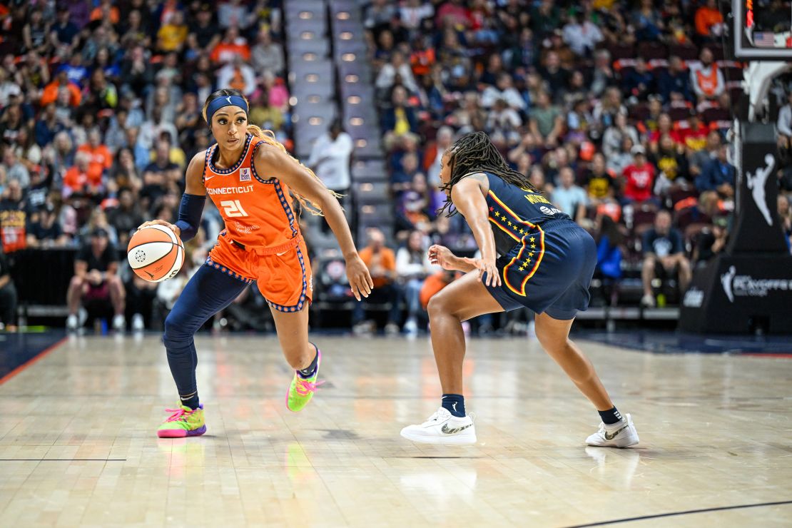 Connecticut Sun guard DiJonai Carrington dribbles the ball against the Indiana Fever.