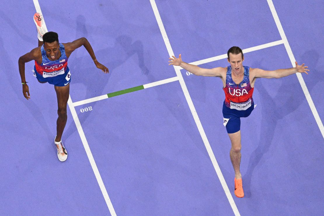 US' Cole Hocker crosses the finish line to win the men's 1500m final of the athletics event ahead of US' Yared Nuguse at the Paris 2024 Olympic Games at Stade de France in Saint-Denis, north of Paris, on August 6, 2024. (Photo by Antonin THUILLIER / AFP) (Photo by ANTONIN THUILLIER/AFP via Getty Images)