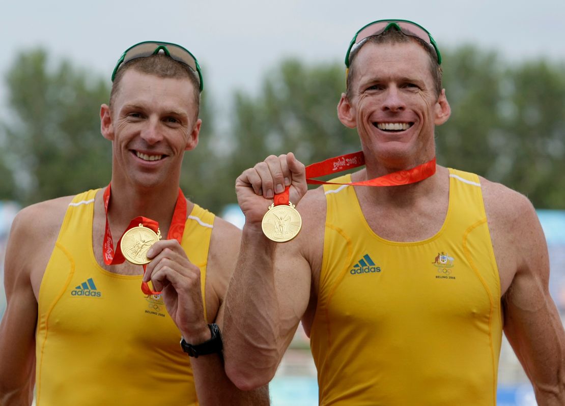 Australia's Drew Ginn (left) and Duncan Free show their gold medals in the rowing men's pair at the Beijing 2008 Olympics on August 16, 2008.