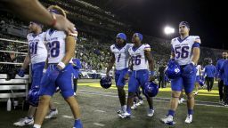 Boise State players leave the field after a loss to Oregon in an NCAA college football game, Saturday, Sept. 7, 2024, at Autzen Stadium in Eugene, Ore. (AP Photo/Lydia Ely)