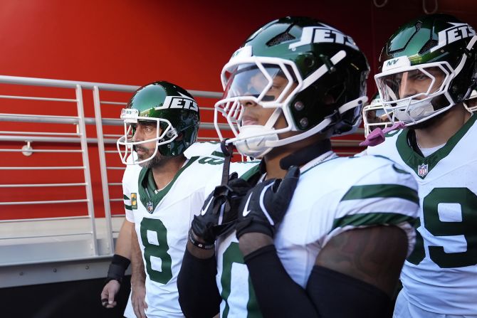 New York Jets quarterback Aaron Rodgers and teammates wait in a tunnel before a game against the San Francisco 49ers in Santa Clara, California, on Monday, September 9. This is the first game back for Rodgers since tearing his Achilles tendon last year after his first game of the season.