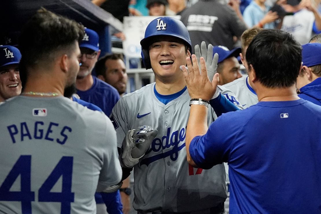 Los Angeles Dodgers' Shohei Ohtani (17) celebrates after hitting his 50th home run of the season during the seventh inning of a baseball game against the Miami Marlins, Thursday, Sept. 19, 2024, in Miami. (AP Photo/Marta Lavandier)