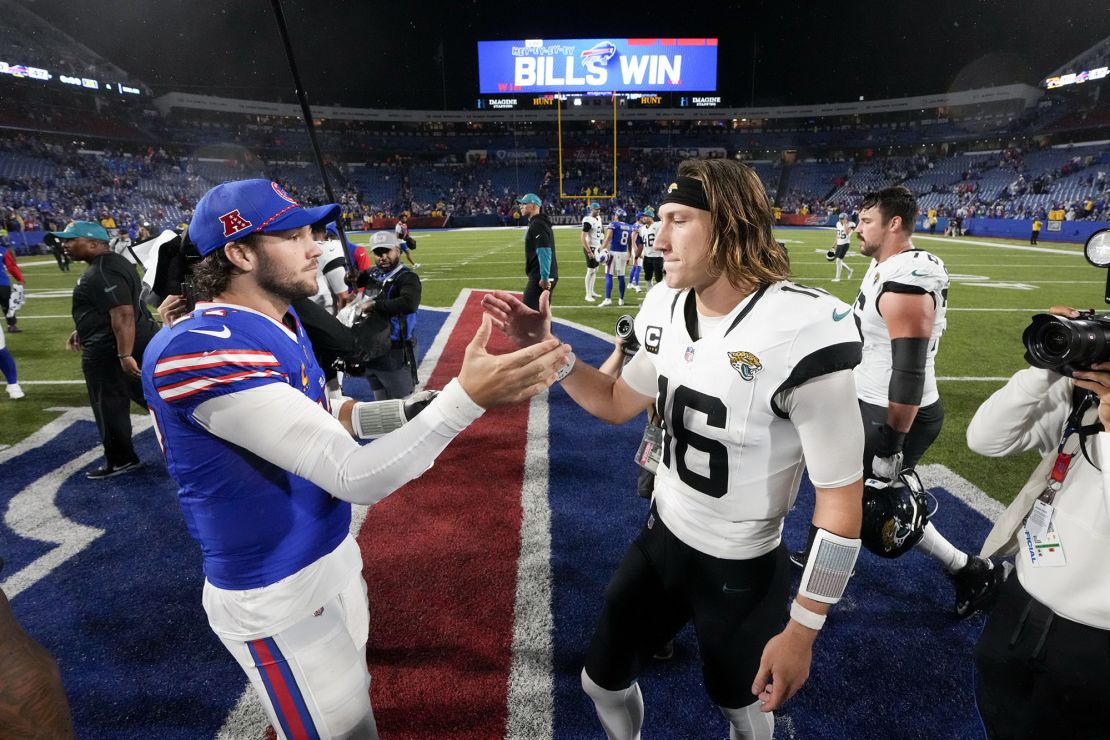 Bills quarterback Allen (left) shakes hands with Jaguars quarterback Lawrence (right) after Buffalo's victory.