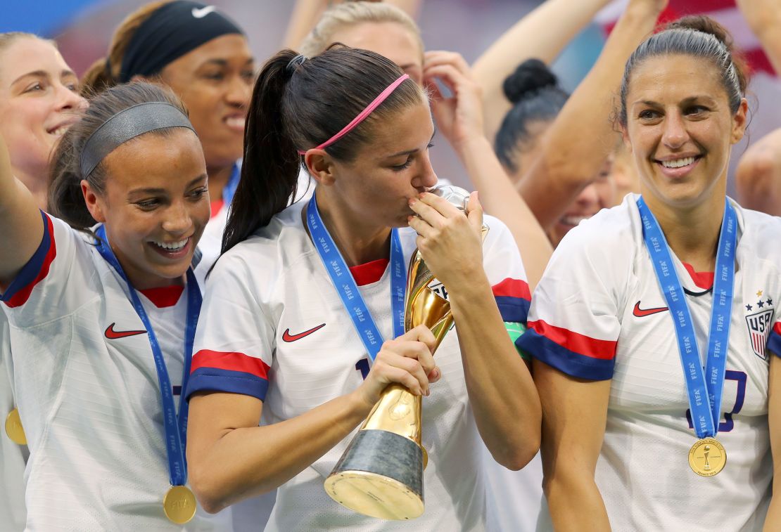 Morgan celebrates with the World Cup trophy in 2019.