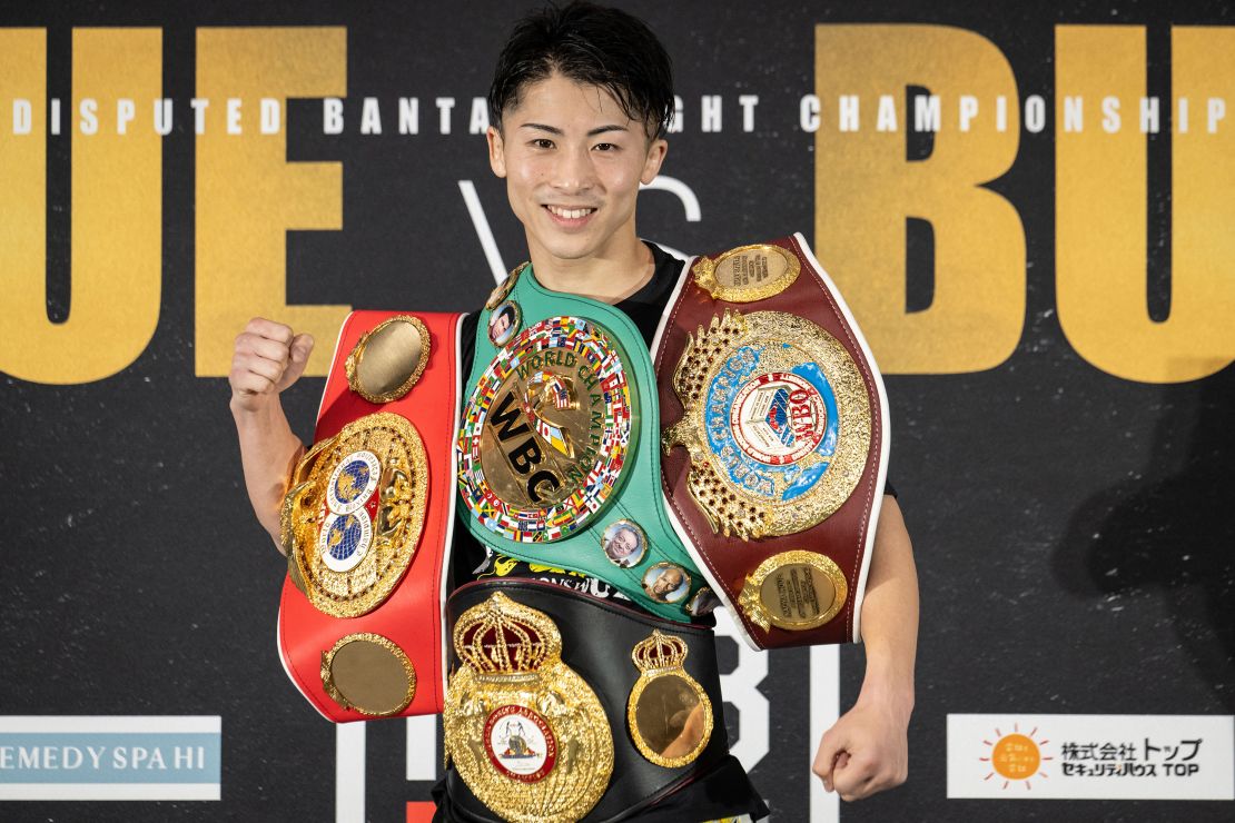 Inoue poses for a photograph during a press conference after beating Britain's Paul Butler in his bantamweight title unification match in Tokyo on December 13, 2022.