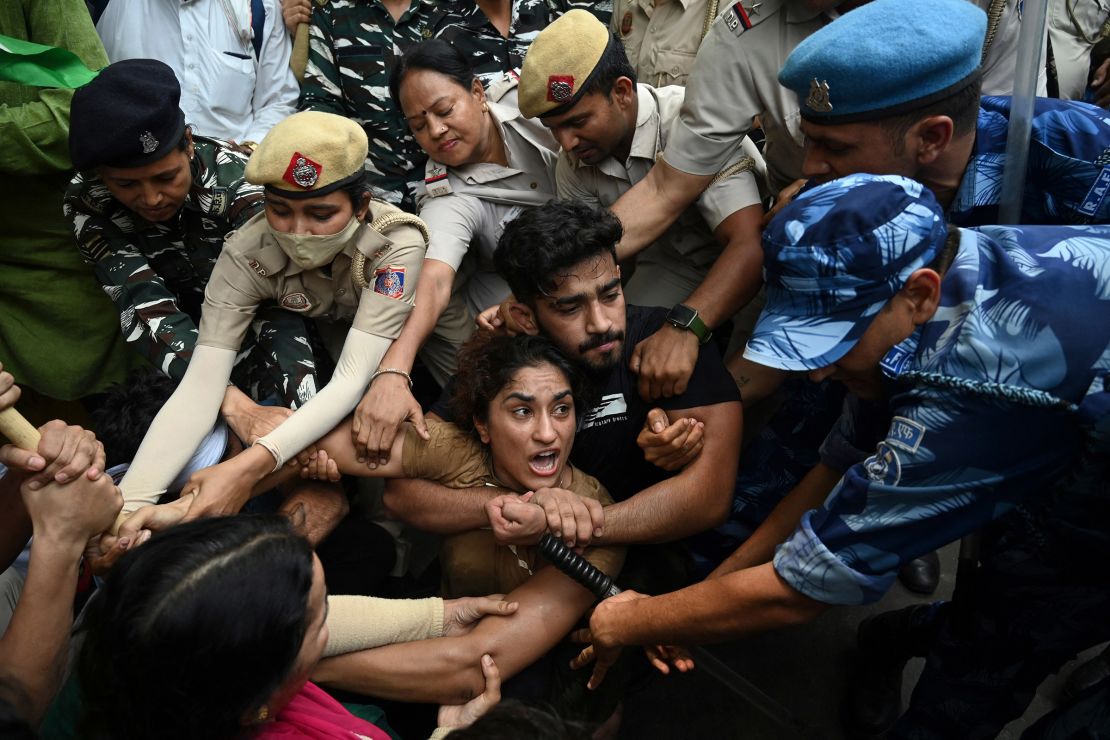 Indian wrestler Vinesh Phogat is detained by police during a protest in New Delhi on May 28, 2023.