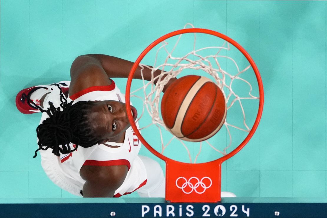 An overview shows USA's #08 Chelsea Gray eyeing the ball in the women's preliminary round group C basketball match between USA and Japan during the Paris 2024 Olympic Games at the Pierre-Mauroy stadium in Villeneuve-d'Ascq, northern France, on July 29, 2024. (Photo by POOL / AFP) (Photo by -/POOL/AFP via Getty Images)